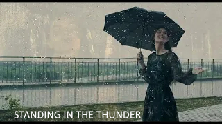 STANDING IN THE THUNDER